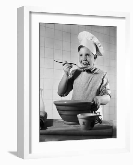 Boy Tasting His Cooking-Philip Gendreau-Framed Photographic Print