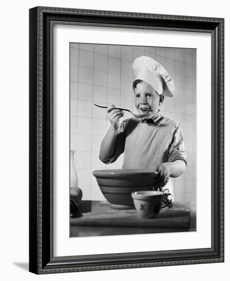 Boy Tasting His Cooking-Philip Gendreau-Framed Photographic Print