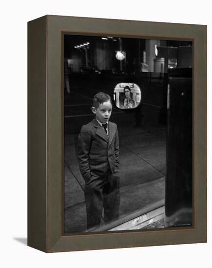 Boy Watching TV on Store Window Set, Glass Reflects the Image Off TV Screen-Ralph Morse-Framed Premier Image Canvas