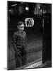 Boy Watching TV on Store Window Set, Glass Reflects the Image Off TV Screen-Ralph Morse-Mounted Photographic Print
