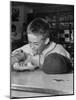 Boy Wearing Baseball Uniform Eating Banana Split at Soda Fountain Counter-Joe Scherschel-Mounted Photographic Print