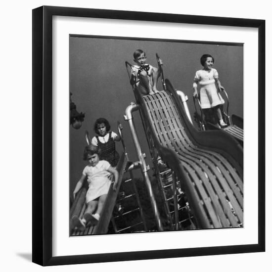 Boys and Girls Play on the Slides at a Playground-null-Framed Photographic Print