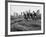 Boys Climbing About on Rock Formation in Central Park as Essex House Looms Amidst Skyline of City-Bill Ray-Framed Photographic Print