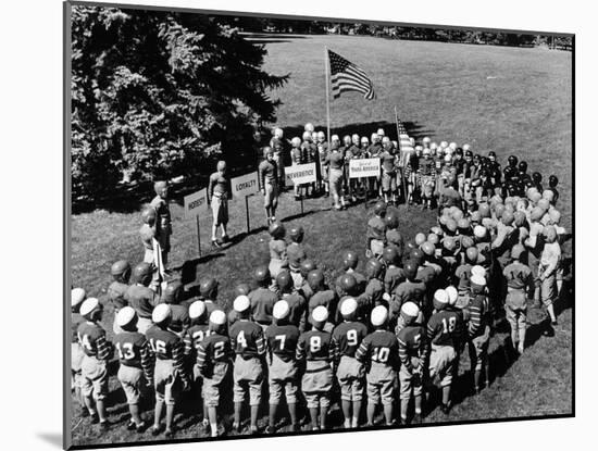 Boys in Circle for Ceremony Before Playing Young American Football League Games-Alfred Eisenstaedt-Mounted Photographic Print