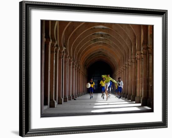 Boys Play Soccer Through an Arched Hallway at the Allahabad University Campus-null-Framed Photographic Print