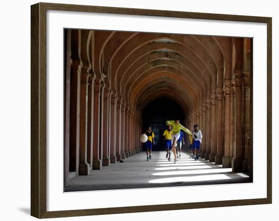 Boys Play Soccer Through an Arched Hallway at the Allahabad University Campus-null-Framed Photographic Print