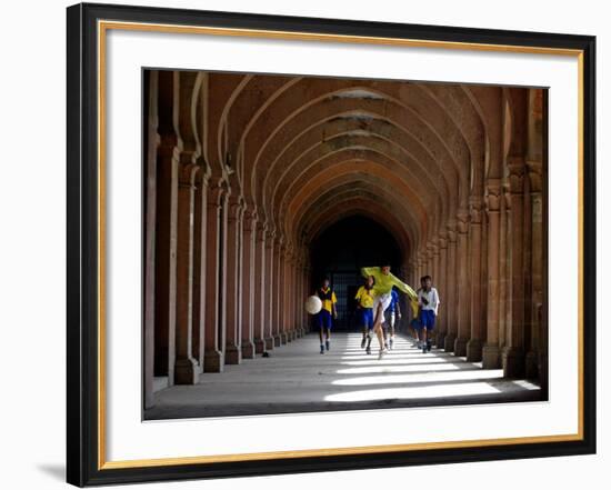 Boys Play Soccer Through an Arched Hallway at the Allahabad University Campus-null-Framed Photographic Print