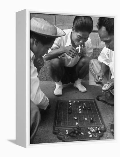 Boys Playing Board Game on Sidewalk in Front of the Trocadero Hotel-Dmitri Kessel-Framed Premier Image Canvas