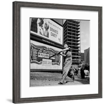 Boys Playing Stickball in Vacant Lot Next to Drake's Cake and Movie "Carnegie Hall"-Ralph Morse-Framed Photographic Print