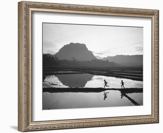 Boys Running Through Flooded Rice Paddy-John Dominis-Framed Photographic Print