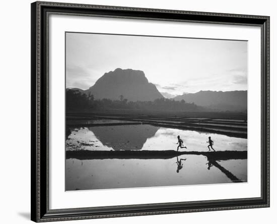 Boys Running Through Flooded Rice Paddy-John Dominis-Framed Photographic Print