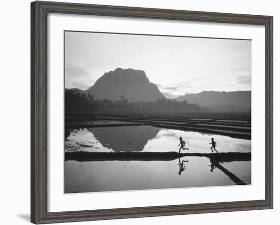 Boys Running Through Flooded Rice Paddy-John Dominis-Framed Photographic Print