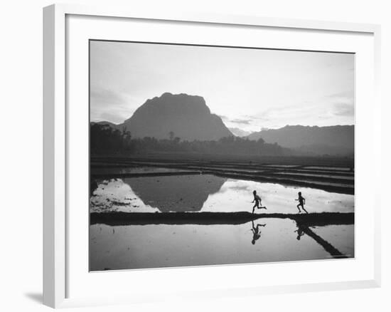 Boys Running Through Flooded Rice Paddy-John Dominis-Framed Photographic Print