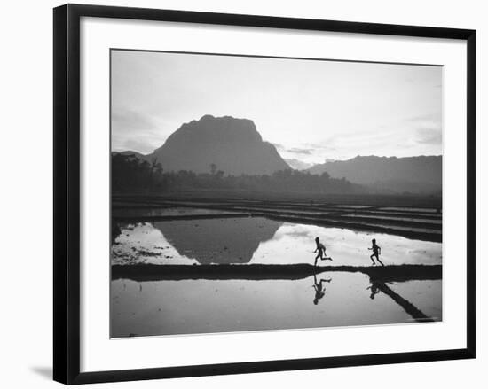 Boys Running Through Flooded Rice Paddy-John Dominis-Framed Photographic Print