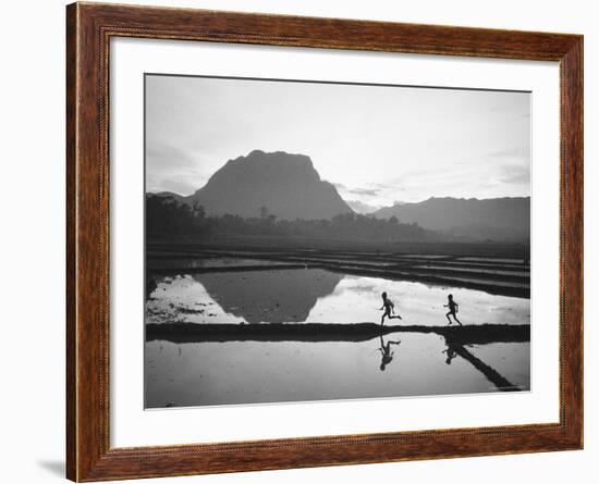 Boys Running Through Flooded Rice Paddy-John Dominis-Framed Photographic Print