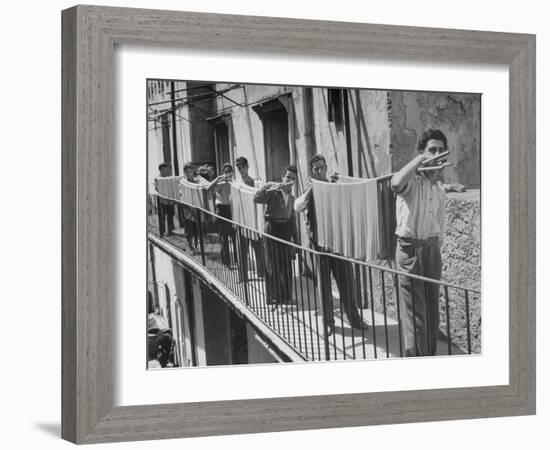 Boys Working in Pasta Factory Carry Rods of Pasta to Drying Rooms-Alfred Eisenstaedt-Framed Photographic Print