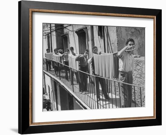 Boys Working in Pasta Factory Carry Rods of Pasta to Drying Rooms-Alfred Eisenstaedt-Framed Photographic Print