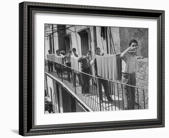 Boys Working in Pasta Factory Carry Rods of Pasta to Drying Rooms-Alfred Eisenstaedt-Framed Photographic Print