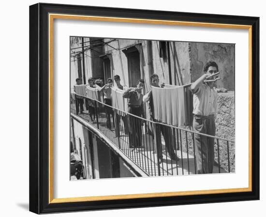 Boys Working in Pasta Factory Carry Rods of Pasta to Drying Rooms-Alfred Eisenstaedt-Framed Photographic Print