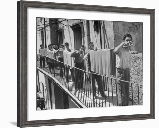 Boys Working in Pasta Factory Carry Rods of Pasta to Drying Rooms-Alfred Eisenstaedt-Framed Photographic Print