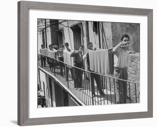 Boys Working in Pasta Factory Carry Rods of Pasta to Drying Rooms-Alfred Eisenstaedt-Framed Photographic Print