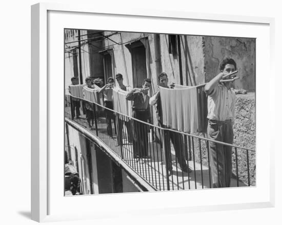 Boys Working in Pasta Factory Carry Rods of Pasta to Drying Rooms-Alfred Eisenstaedt-Framed Photographic Print