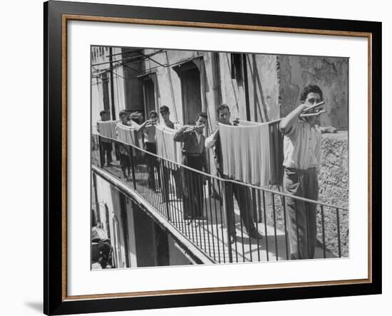 Boys Working in Pasta Factory Carry Rods of Pasta to Drying Rooms-Alfred Eisenstaedt-Framed Photographic Print