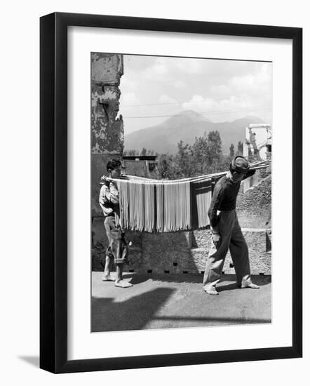 Boys Working in Pasta Factory Carry Rods of Pasta to Drying Rooms-Alfred Eisenstaedt-Framed Photographic Print