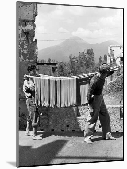 Boys Working in Pasta Factory Carry Rods of Pasta to Drying Rooms-Alfred Eisenstaedt-Mounted Photographic Print