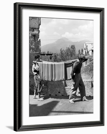 Boys Working in Pasta Factory Carry Rods of Pasta to Drying Rooms-Alfred Eisenstaedt-Framed Photographic Print