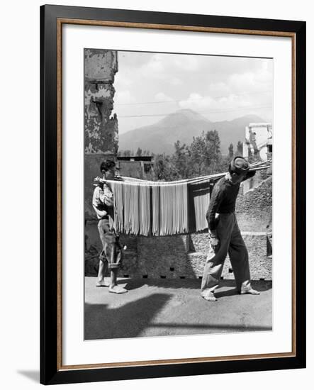 Boys Working in Pasta Factory Carry Rods of Pasta to Drying Rooms-Alfred Eisenstaedt-Framed Photographic Print