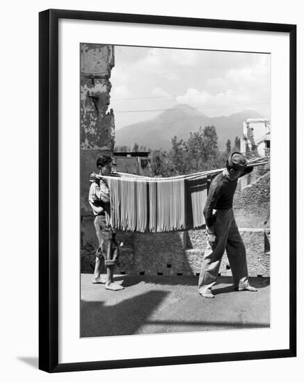 Boys Working in Pasta Factory Carry Rods of Pasta to Drying Rooms-Alfred Eisenstaedt-Framed Photographic Print