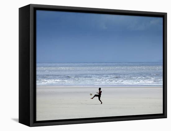 Brazil, Maranhao, Sao Luis, Sao Marcos Beach, Boy Playing Football on the Beach-Alex Robinson-Framed Premier Image Canvas