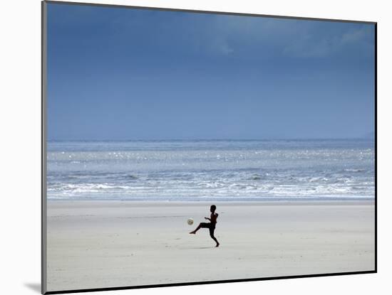 Brazil, Maranhao, Sao Luis, Sao Marcos Beach, Boy Playing Football on the Beach-Alex Robinson-Mounted Photographic Print