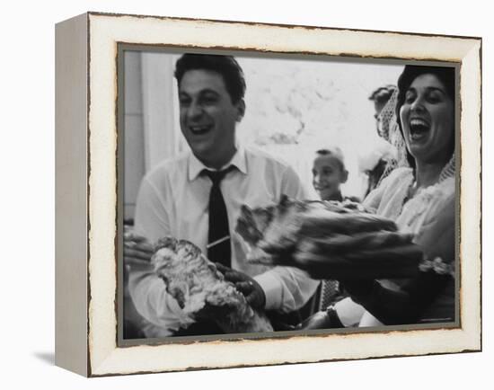 Bride and Groom Breaking Bread During Wedding-Paul Schutzer-Framed Premier Image Canvas