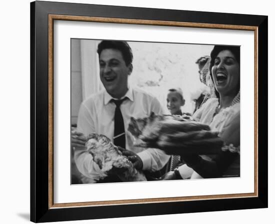 Bride and Groom Breaking Bread During Wedding-Paul Schutzer-Framed Photographic Print