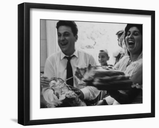 Bride and Groom Breaking Bread During Wedding-Paul Schutzer-Framed Photographic Print