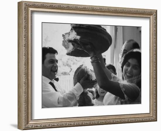 Bride and Groom Breaking Bread During Wedding-Paul Schutzer-Framed Photographic Print