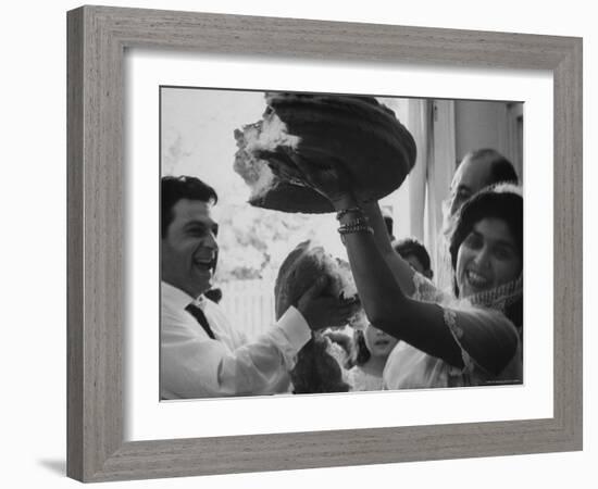 Bride and Groom Breaking Bread During Wedding-Paul Schutzer-Framed Photographic Print