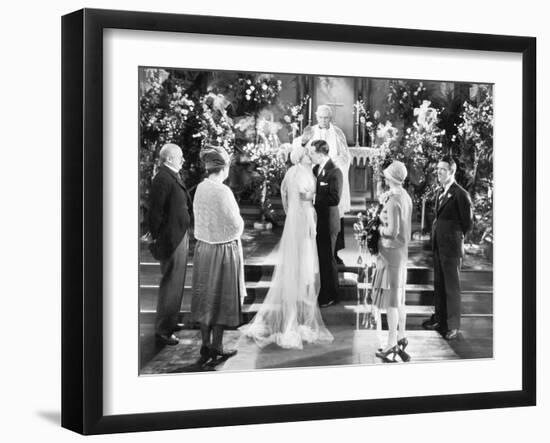 Bride and Groom Kissing after the Wedding Ceremony-null-Framed Photo