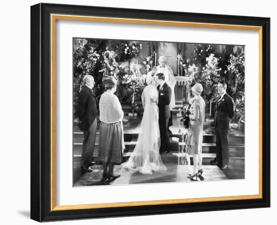 Bride and Groom Kissing after the Wedding Ceremony-null-Framed Photo