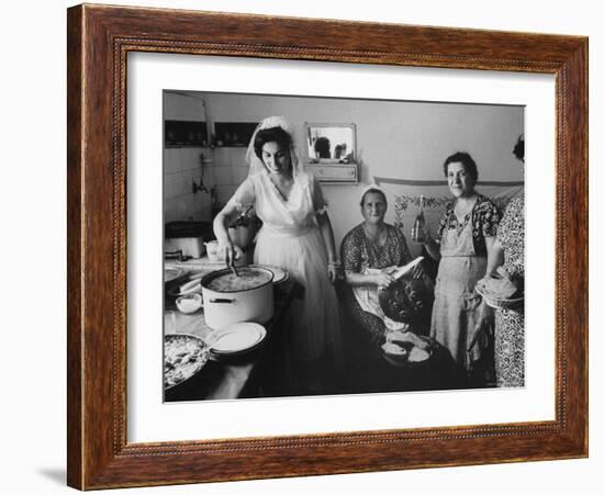 Bride Assisting in Kitchen During Wedding-Paul Schutzer-Framed Photographic Print