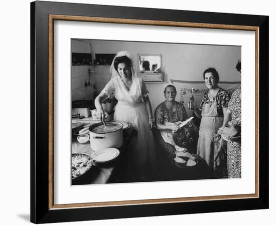 Bride Assisting in Kitchen During Wedding-Paul Schutzer-Framed Photographic Print