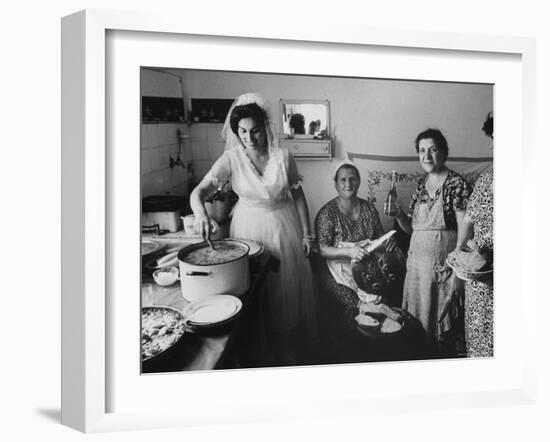 Bride Assisting in Kitchen During Wedding-Paul Schutzer-Framed Photographic Print