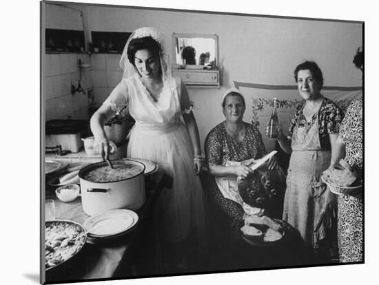Bride Assisting in Kitchen During Wedding-Paul Schutzer-Mounted Photographic Print