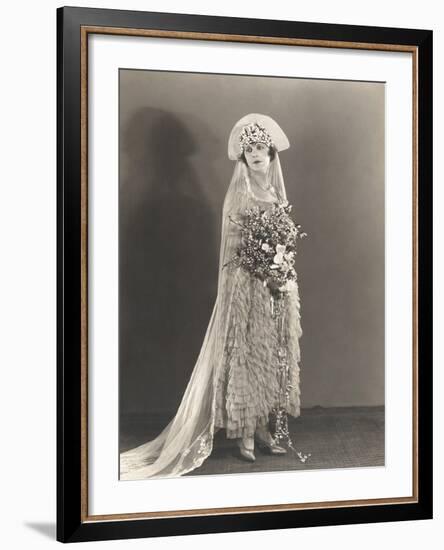 Bride Wearing Ruffled Wedding Gown and Flowered Headdress-null-Framed Photo