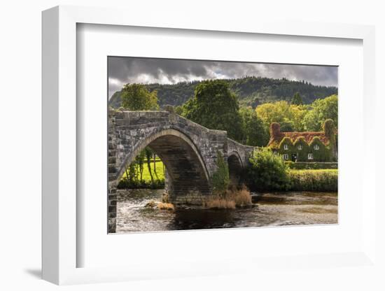 Bridge and ivy covered cottage, Conwy Valley, North Wales, UK-Ross Hoddinott-Framed Photographic Print