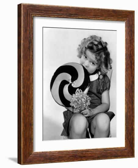 Bright Eyes, Shirley Temple Eating a Big Lollipop, 1934-null-Framed Photo