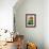 Bright orange flower on display on a kitchen table-Stacy Bass-Framed Photo displayed on a wall