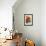 Bright orange flowers on display on kitchen table-Stacy Bass-Framed Photo displayed on a wall